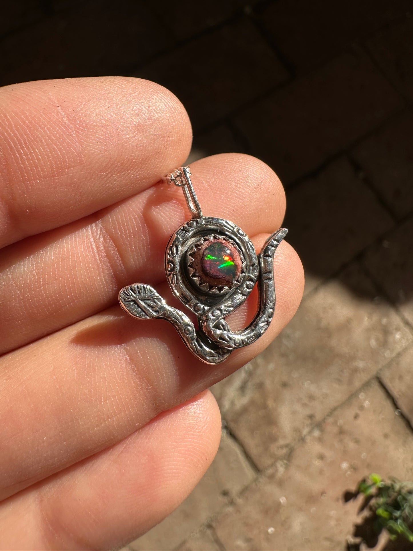 Opal snake charmer